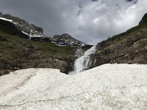 Waterfall and glacier in Glacier National Park