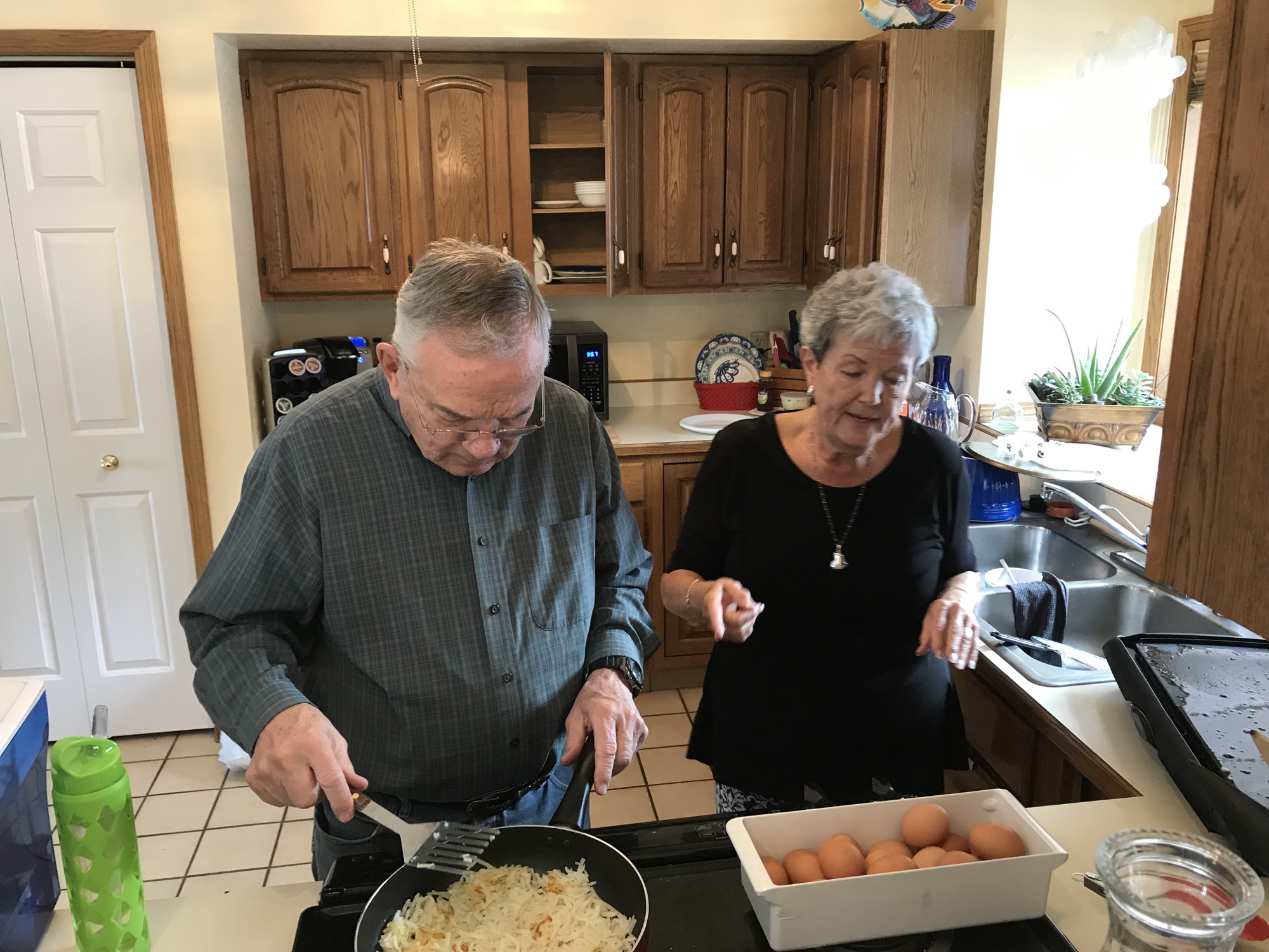 Grandpa and grandma making breakfast